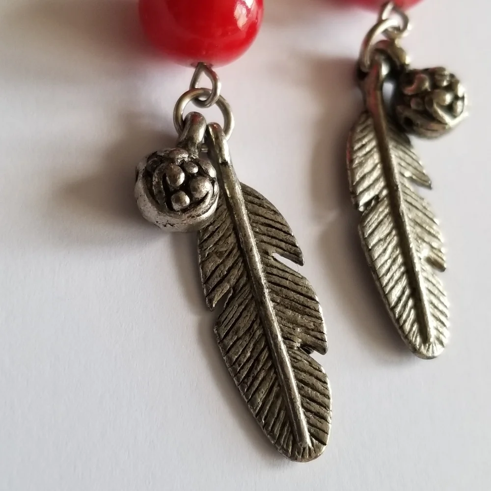 Feather earrings with red beads and flower ball beads silver tone boho